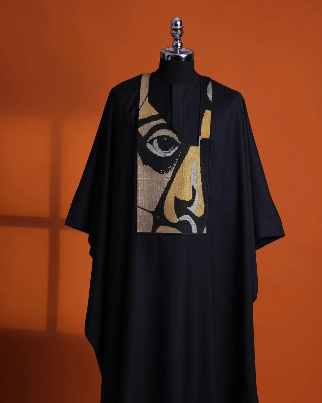 A Charcoal black, “Oju Aye” on canvas gold and black mix embroidery details Agbada