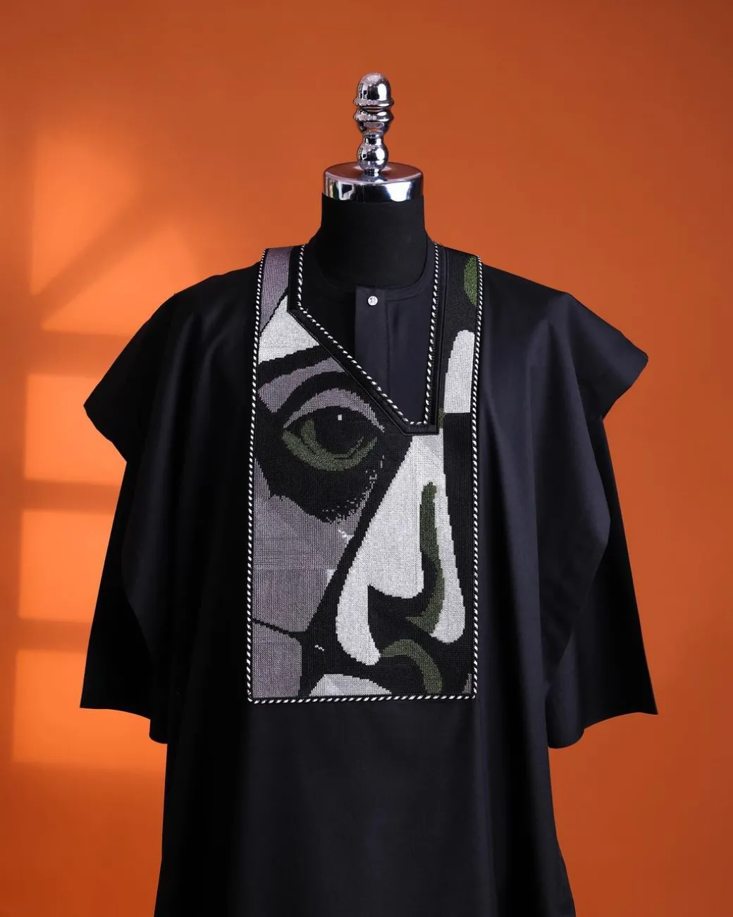 A Charcoal black, “Oju Aye” on canvas embroidery details agbada, silver clear view Swarovski buttons on 3/4 sleeve kaftan & sokoto