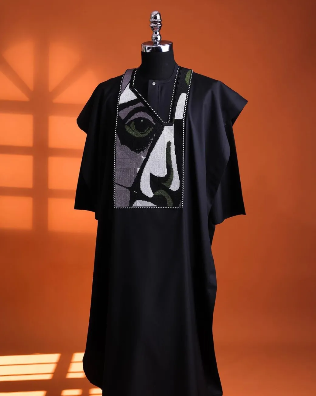 A Charcoal black, “Oju Aye” on canvas embroidery details agbada, silver clear view Swarovski buttons on 3/4 sleeve kaftan & sokoto