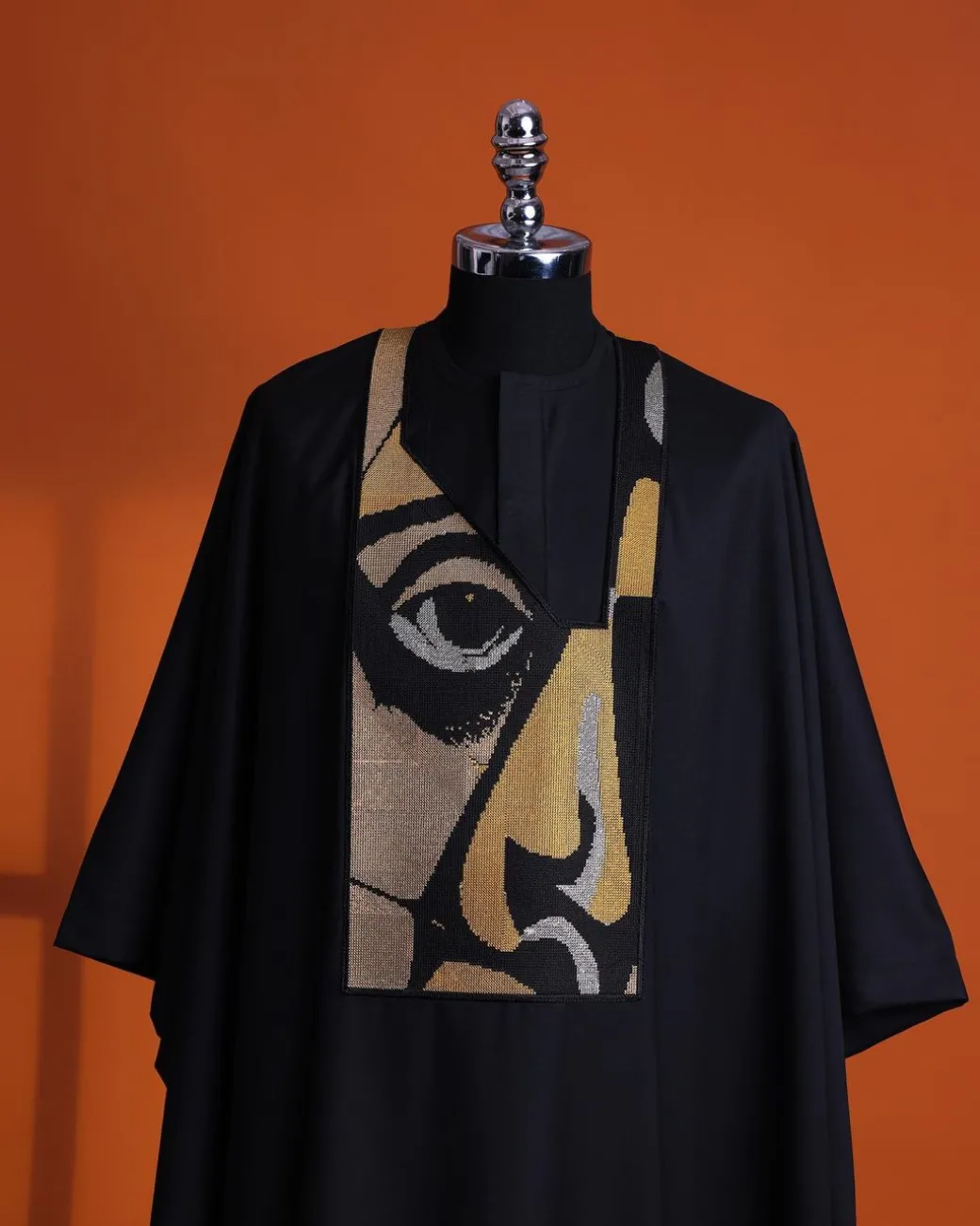 A Charcoal black, “Oju Aye” on canvas gold and black mix embroidery details Agbada