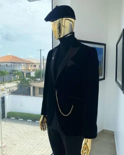 A charcoal black peak lapel-soaked Italian velvet tuxedo suit