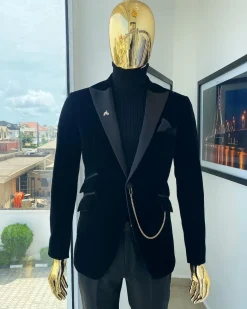 A charcoal black peak lapel soaked Italian velvet tuxedo suit