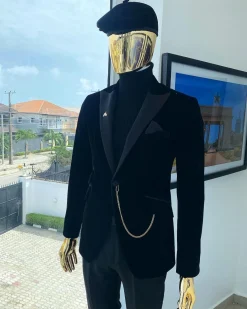 A charcoal black peak lapel-soaked Italian velvet tuxedo suit