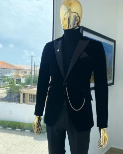 A charcoal black peak lapel soaked Italian velvet tuxedo suit