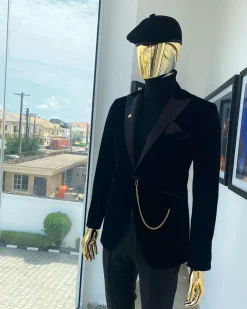 A charcoal black peak lapel-soaked Italian velvet tuxedo suit