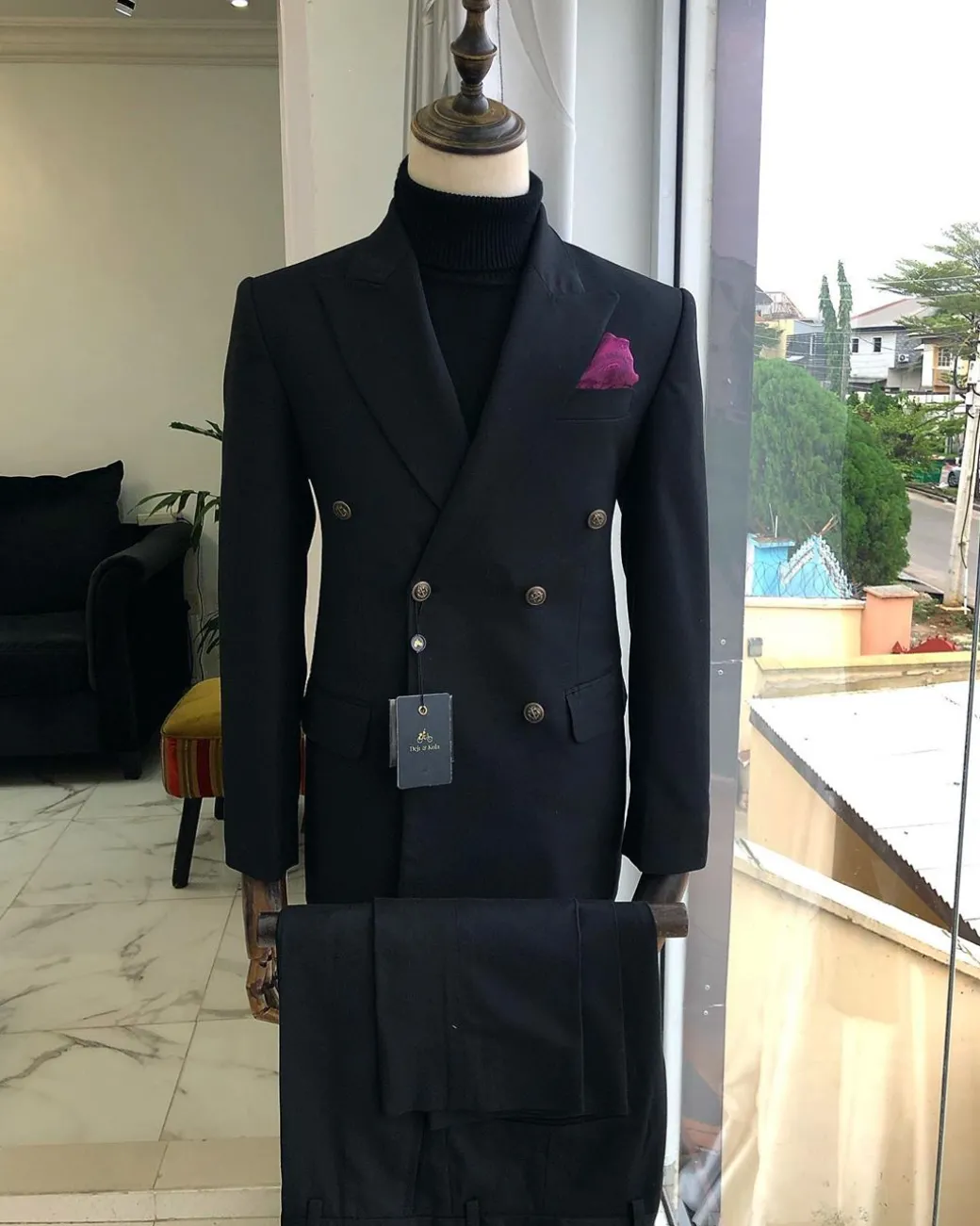 A Charcoal Black Peak Lapel double breasted Suit
