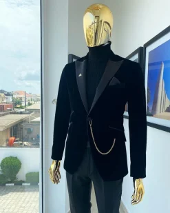 A charcoal black peak lapel soaked Italian velvet tuxedo suit