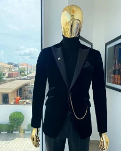 A charcoal black peak lapel soaked Italian velvet tuxedo suit