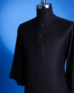 A charcoal black, pen stripe, front flap with Swarovski button, knitted curved pocket, 3/4 sleeve African senator kaftan native.