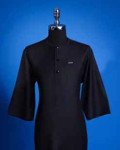 A charcoal black, pen stripe, front flap with Swarovski button, knitted curved pocket, 3/4 sleeve African senator kaftan native.