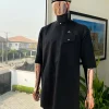 A Charcoal black, slanting combat pocket, front flap with clear view swarovski button detailing african traditional senator kaftan native.