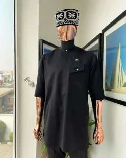 A Charcoal black, slanting combat pocket, front flap with clear view swarovski button detailing african traditional senator kaftan native.