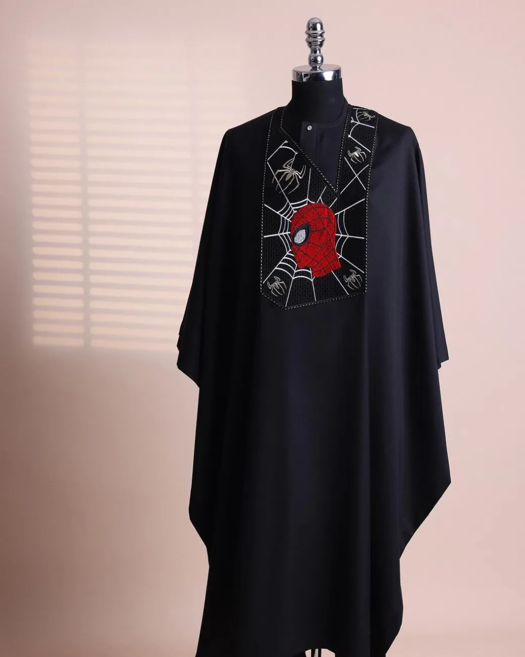 A charcoal black, “Spider-Man” embroidery details agbada, 3/4 sleeve kaftan & sokoto