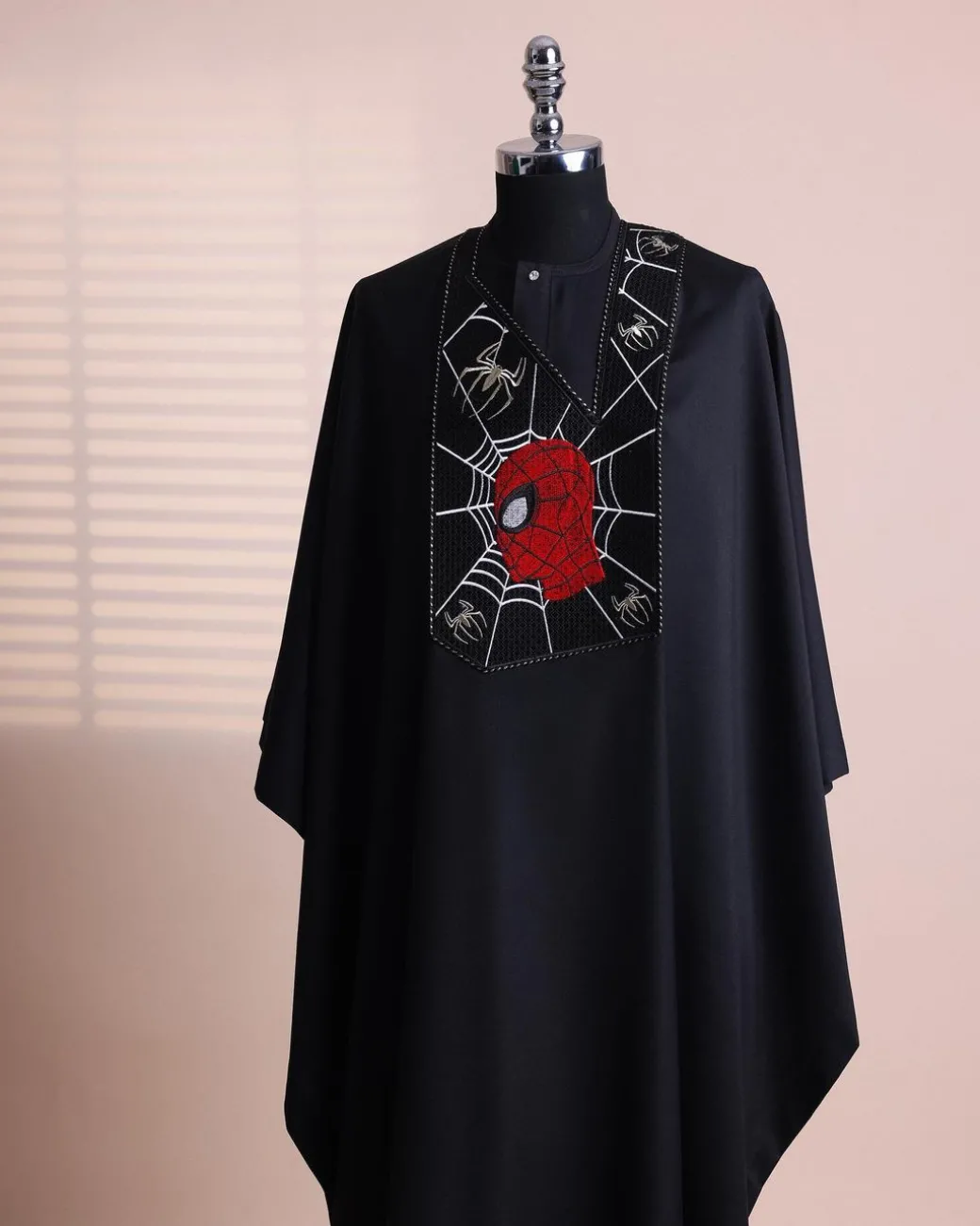 A charcoal black, “Spider-Man” embroidery details agbada, 3/4 sleeve kaftan & sokoto