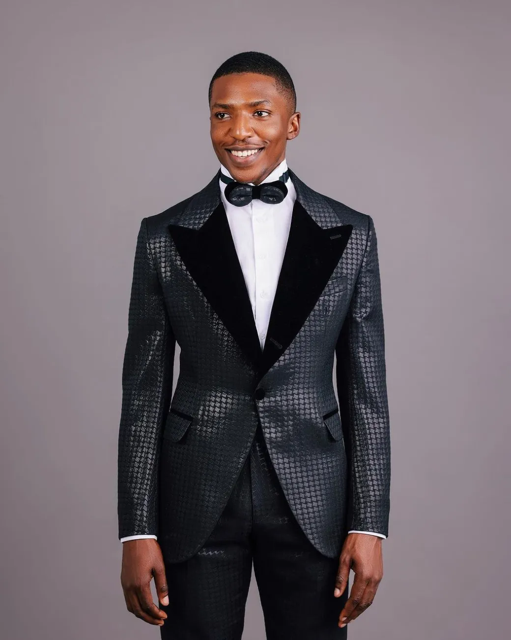 A Charcoal Black, Stuffed Or Slanted Square-Patterned Jacquard Peak lapel Tuxedo Suit