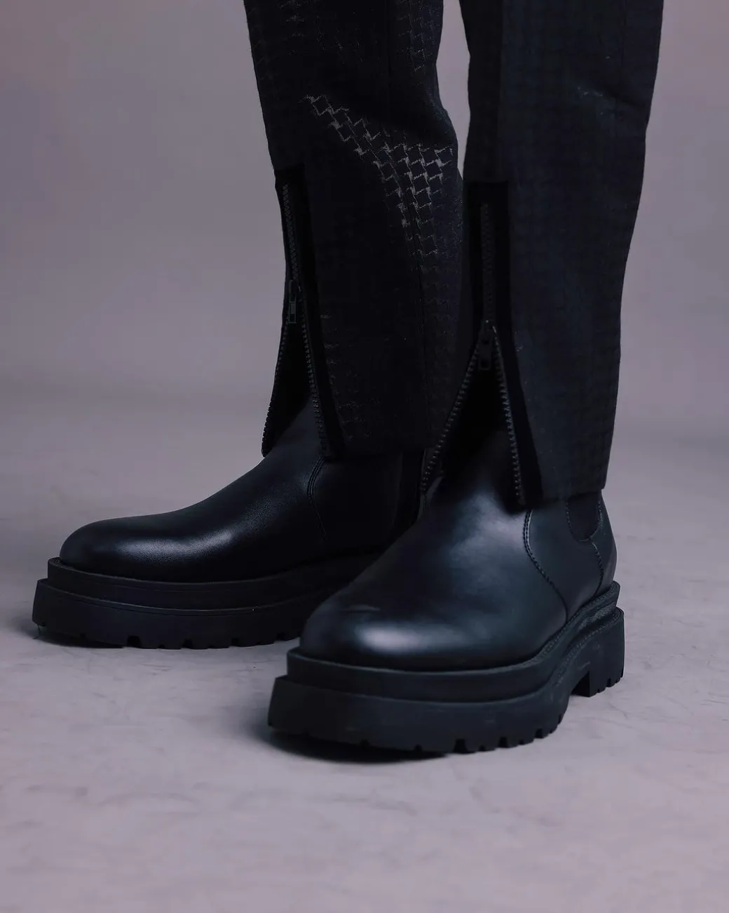 A Charcoal Black, Stuffed/Slanted Square-Patterned Jacquard pant with zip-line detailing