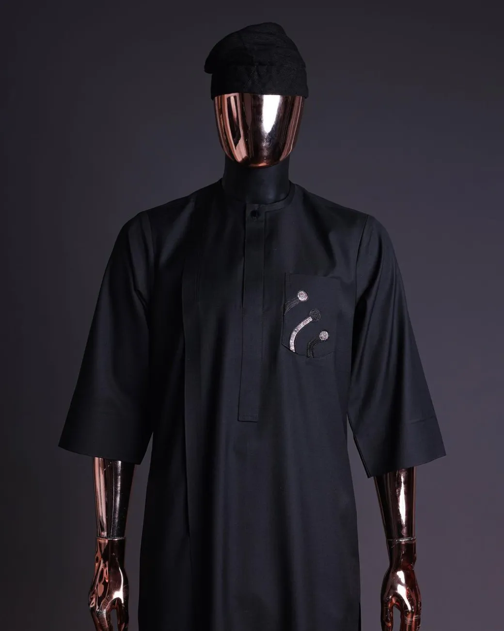 A charcoal black, thrown javelin embrodery details, 3/4 sleeve African senator kaftan native.