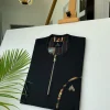 A Charcoal Black with a gold zip opening, a cross-display functional pocket Kaftan