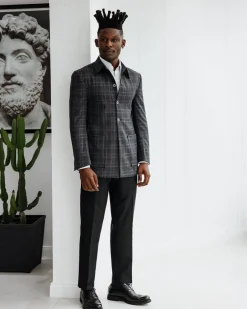 A Charcoal grey, windowpane check, nobility fabric cover coat with patch pocket detailing