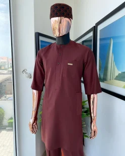 A cinnamon brown 3/4 sleeve kaftan, Swarovski buttons flap, and layered eggplant embroidery hat detail traditional senator kaftan native