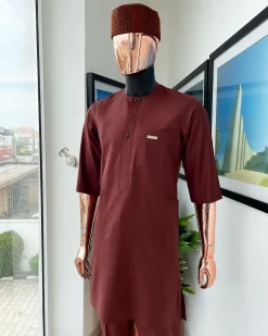 A cinnamon brown 3/4 sleeve kaftan, Swarovski buttons, flap, and spiral binding embroidery hat detailing traditional senator kaftan native