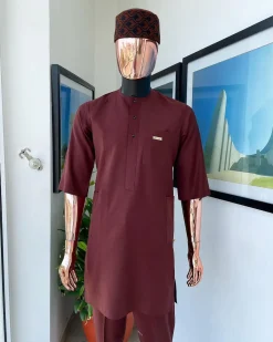 A cinnamon brown 3/4 sleeve kaftan, Swarovski buttons flap, and layered eggplant embroidery hat detail traditional senator kaftan native