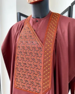 A Cinnamon brown spiral binding embroidery detailing with black and gold ss20 Swarovski stud agbada