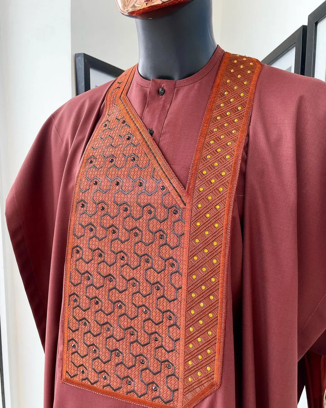 A Cinnamon brown spiral binding embroidery detailing with black and gold ss20 Swarovski stud agbada