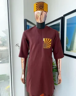 A Cinnamon brown, sunset in the east embroidery detailing hat and patch pocket traditional senator kaftan native.