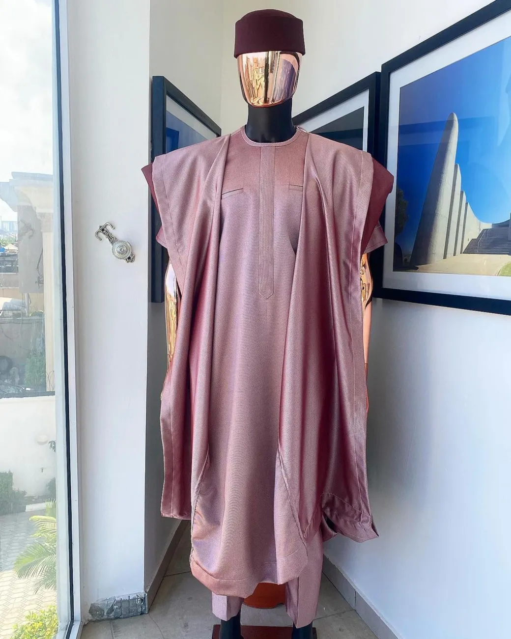 A classic light burgundy “kagbada”, Senator kaftan, burgundy round hat And sokoto