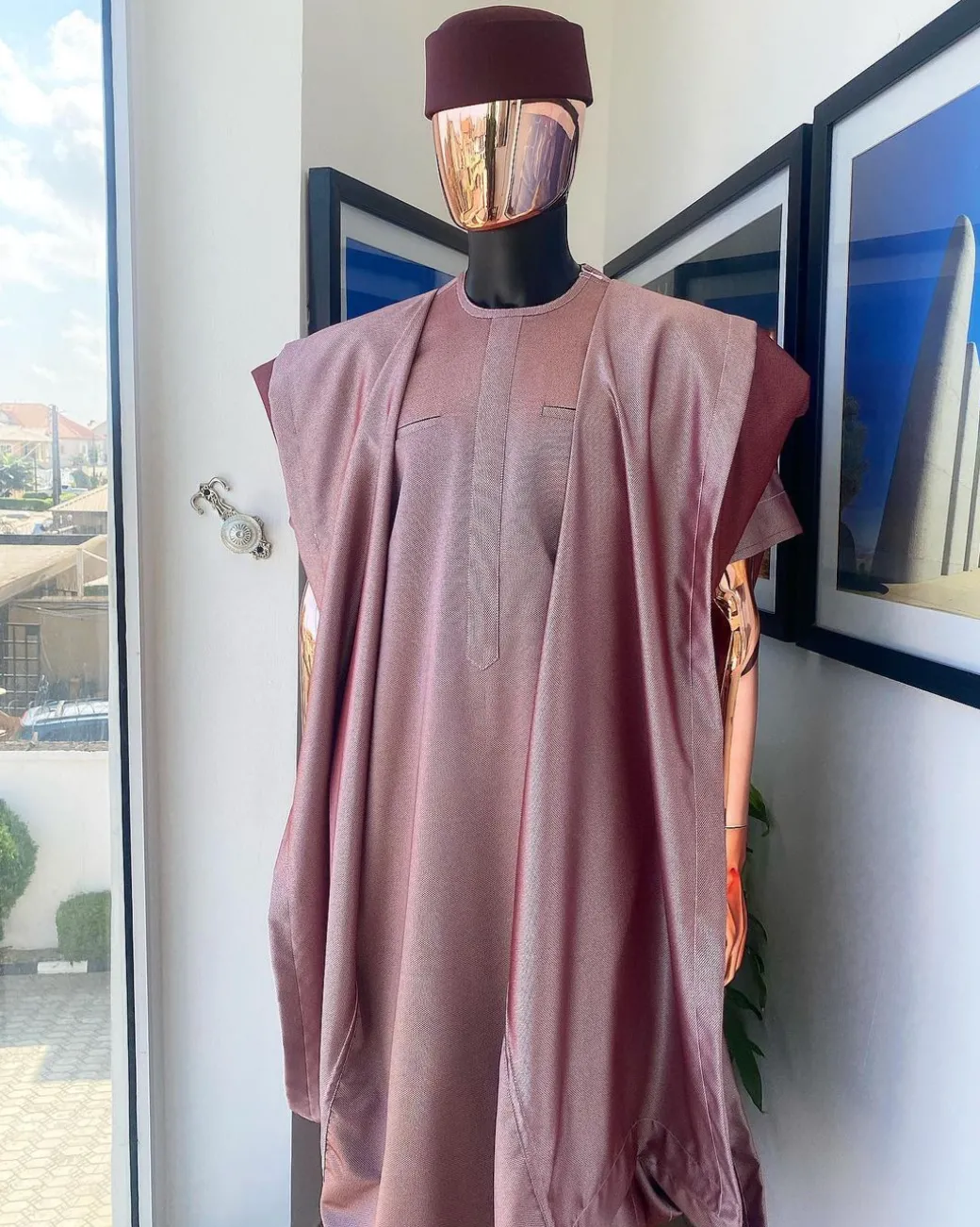 A classic light burgundy “kagbada”, Senator kaftan, burgundy round hat And sokoto
