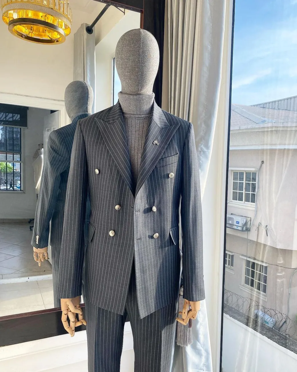 A Classic Peak Lapel Grey Pin Stripe Double Breasted Suit