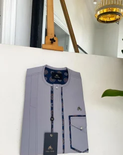 A Cloud Grey, clear view transparent Swarovski buttons, front flap, edge paisley cut pocket details African traditional senator kaftan native.