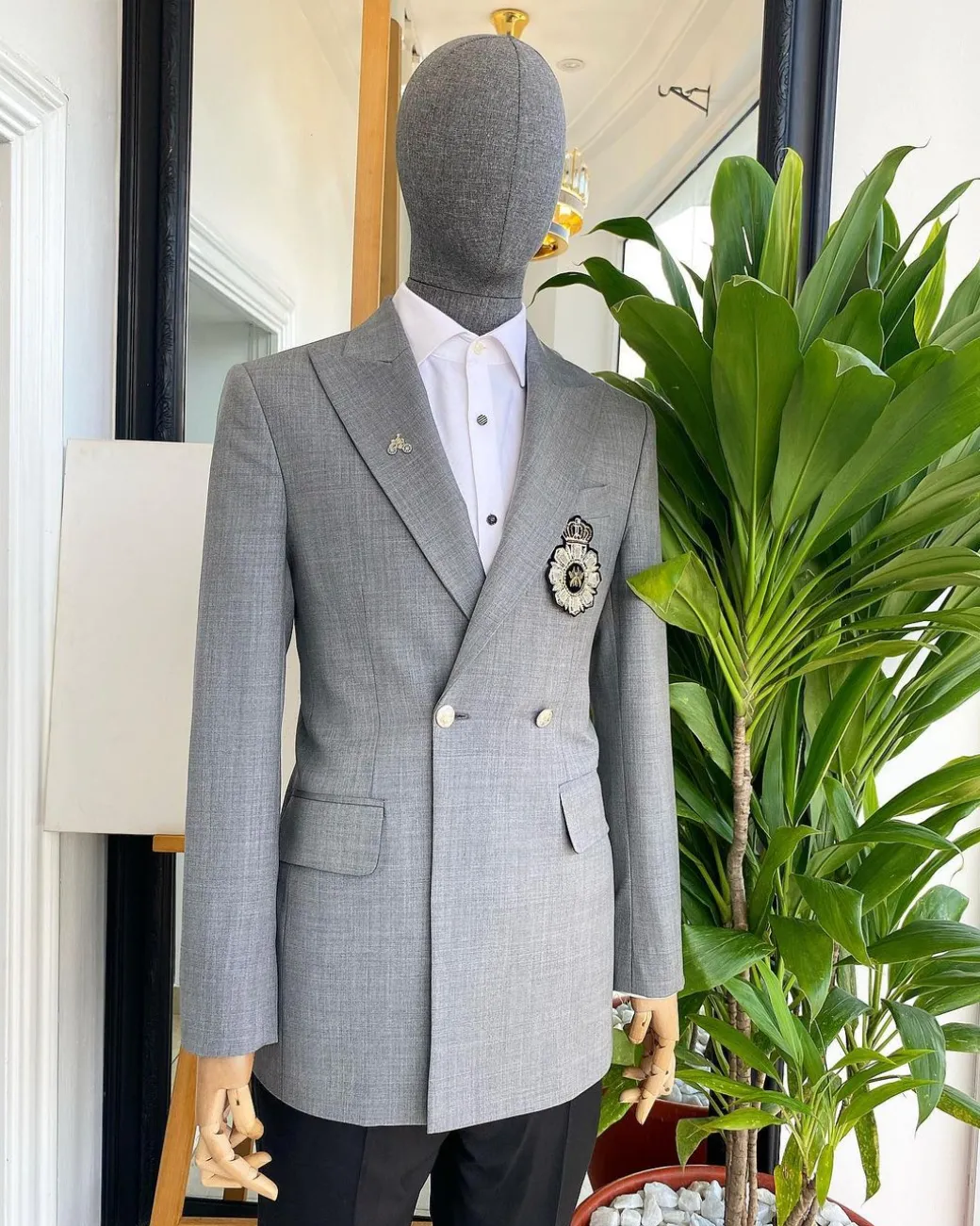 A Cloud Grey Peak Lapel, One button Double Breasted Suit.