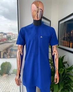 A cobalt blue front flap with a patch pocket details African traditional senator kaftan native