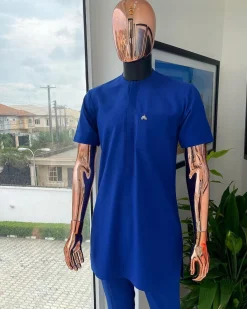 A cobalt blue front flap with a patch pocket details African traditional senator kaftan native