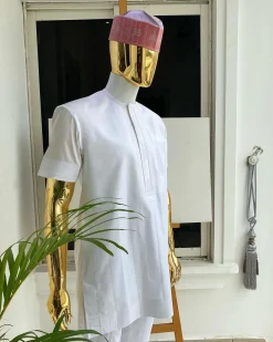 A Cocaine white voil short sleeve men’s tailored senator kaftan with a light weave pink kanuri hat