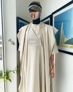 A coconut ivory, jakan design agbada, 3/4 sleeve buba laced with Swarovski stone button details and sokoto