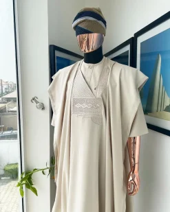 A coconut ivory, jakan design agbada, 3/4 sleeve buba laced with Swarovski stone button details and sokoto