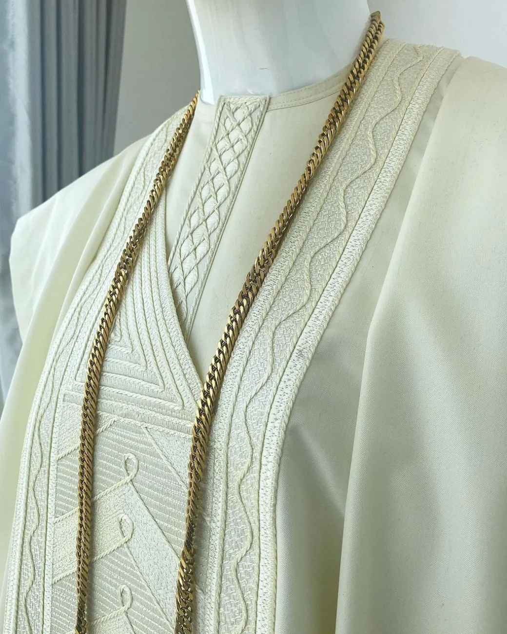 A cream African Agbada with interwoven embroidery design, short sleeve senator kaftan and sokoto