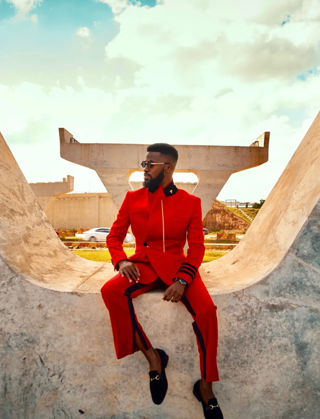 A Crimson red, peak lapel, single button wrap suit
