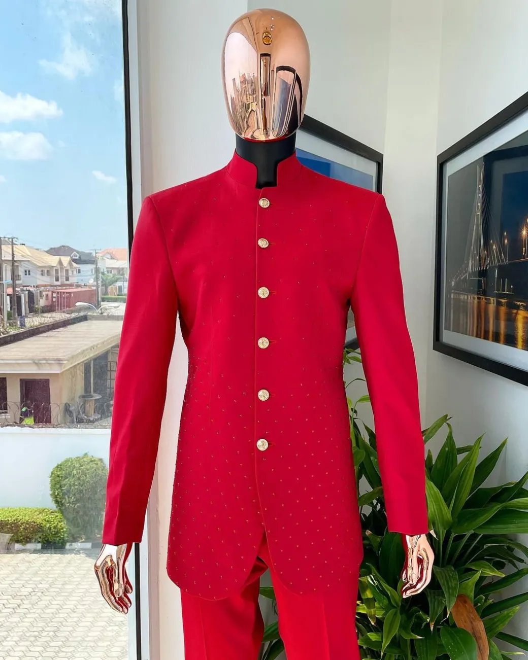 A Crimson red safari suit with matching Swarovski stones detailing