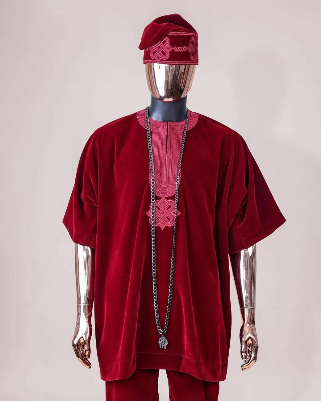 A crimson red, U shaped neck, letters floral, 3/4 sleeve embroidery details African senator kaftan native.