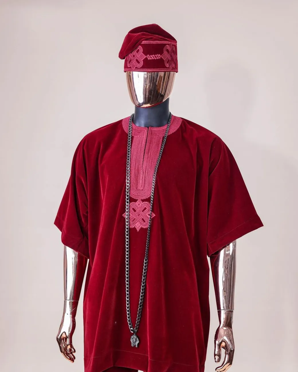 A crimson red, U shaped neck, letters floral, 3/4 sleeve embroidery details African senator kaftan native.