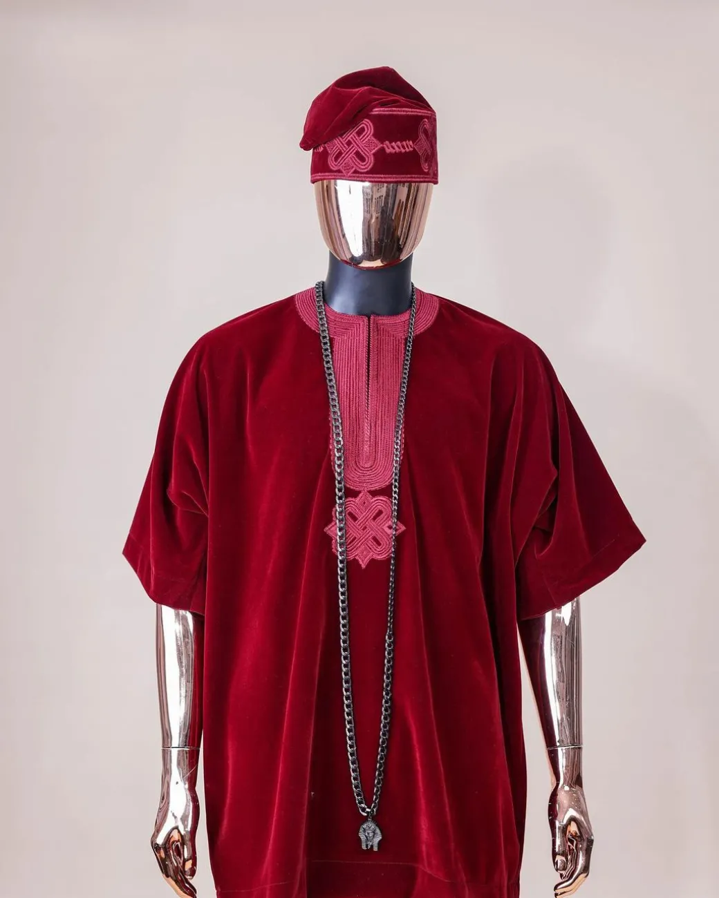 A crimson red, U shaped neck, letters floral, 3/4 sleeve embroidery details African senator kaftan native.