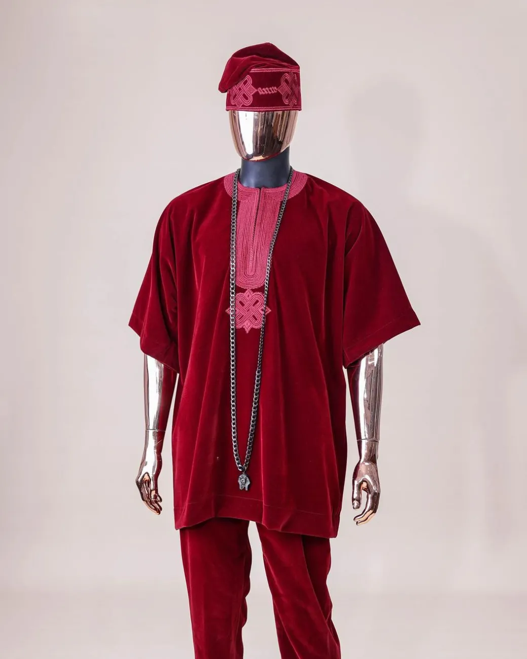 A crimson red, U shaped neck, letters floral, 3/4 sleeve embroidery details African senator kaftan native.