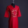 A Crimson red, U-shaped neck, letters floral, 3/4 sleeve embroidery detail African senator Kaftan.