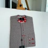 A Dark brown windowpane check, cross-details front flap, and sliding patch pocket African traditional kaftan native