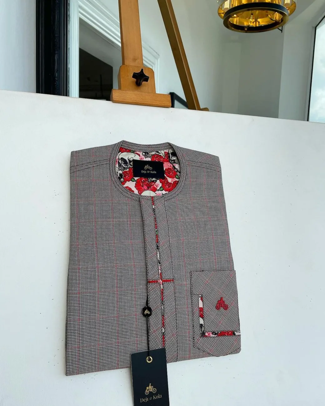 A Dark brown windowpane check, cross-details front flap, and sliding patch pocket African traditional kaftan native