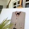 A Dark cream african kaftan With Paisley detailing